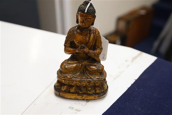 A Chinese gilt lacquered bronze figure of Buddha, 18th/19th century, H. 7.3cm, repair to neck